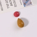 Close-up of polished red round and yellow teardrop resin cabochons for DIY jewelry - Rose Red Half-Round and Coffee Waterdrop Set