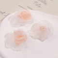 Detail of multi-layer gradient organza flower petals for DIY hair accessories - Orange
