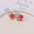 Detail view of pink irregular crystal cube charms with gold frames for DIY jewelry making - Watermelon red