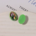 Close-up of vibrant green oval resin charms with iridescent abalone shell flakes - Small (1 Piece, 10x14mm) / Green