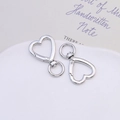 Macro shot of silver zinc alloy heart-shaped spring clasps with 360-degree swivel ring - Heart Swivel Clasp / Silver