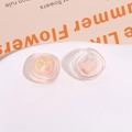 Dettaglio macro di strass geometrici in resina rosa per accessori per capelli fai-da-te - Arancione