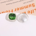 Detailed macro view of square green crystal resin patches for DIY jewelry making - Green