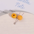 Detailed close-up of 10mm yellow striped wood beads with metal eye pin for DIY jewelry - Yellow