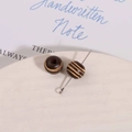 Macro detail of 10mm vintage striped wooden beads for DIY jewelry making and crafts - Brown