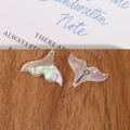 Detailed view of iridescent mother of pearl fishtail pendants for DIY jewelry making - Fishtail Style