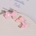 Macro shot of 3D macaron pink bow charms with pearlescent finish and metal pins - 1 Piece/Pack / Light Pink