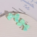 Macro shot of mint green resin bow accessory with iridescent pearlescent finish - 1 Piece / Lake Green