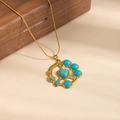 Gold stainless steel necklace featuring a turquoise heart pendant with floral motifs - Geometric Heart Round Turquoise Necklace (0890)