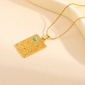 Macro detail of gold necklace featuring dragonfly and flower relief on turquoise pendant - Square Tag Dragonfly Turquoise Necklace (0861)