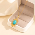 Bohemian gold stainless steel necklace with turquoise pendant on a white jewelry box - Geometric Oval Turquoise Necklace (0848)