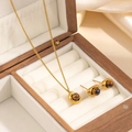 Elegant gold-plated stainless steel jewelry set with round tiger eye stones on fabric - Geometric Brown Stone Necklace Earrings Set