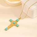 Golden cross necklace featuring turquoise stones and intricate vintage floral engravings - Large Cross Turquoise Necklace (0884)