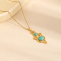 Bohemian gold chain necklace featuring intricate spiral carving and blue turquoise stones - Geometric Vortex Turquoise Necklace (0896)
