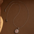 Detailed macro shot of stainless steel necklace with pink rose pendant and lobster clasp - Silver Rose (EXRGN0311)