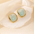 Detailed shot of gold-framed square stud earrings with light blue marble resin inlay - Sea Blue Square Stone Style (0398)