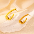 Elegant gold U-shaped titanium steel earrings with white pearls on a stone surface - Hook Artificial Pearl Style (0488)