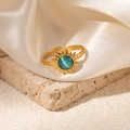 Detail of sunflower ring with blue cat-eye stone on luxury satin and stone background - Sunburst Cyan-Green Stone Adjustable Style (TYR1038)