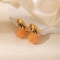Golden wing earrings with orange resin marble texture drop on stone pedestal - Orange-Pink Drop Shape (0392)