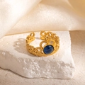 Detail of vintage 18K gold plated crown ring with blue gemstone and filigree metalwork - Crown Design Deep Blue Stone Adjustable Style (TYR1348)