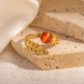 Detail of vintage gold leaf titanium ring featuring a round orange cat's eye gemstone - Wheat Texture Orange Cat's Eye Adjustable Style (TYR1143)