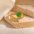 Detail of gold leaf texture ring with green cat eye stone on stone pedestal - Leaf Texture Green Stone Adjustable Style (TYR1140)