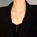 Detail of elegant gold Y-shaped snake chain necklace with adjustable bead slider clasp - Necklace / Gold