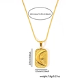 Detail view of gold celestial pendant with moon and sun engraving on fine link chain - Sun Moon Relief Rectangular Style (TY-115)