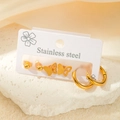Lot de trois paires de boucles d'oreilles et créoles en acier doré 18 carats sur carte - Ensemble Créoles Perle Papillon (TYE0431)