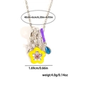 Detail of necklace with star, heart flower, and blue droplet charms on steel chain - Flower Water Drop / Silver