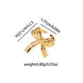 Golden bow ribbon ear cuff accessory with polished finish shown with size dimensions - Gold