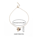 Detail of gold titanium heart and passport pendant necklace with adjustable chain links - Gold Black Graduation Cap Passport Style(EXRGN0390J)