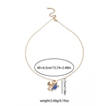 Gold graduation necklace with heart, passport, and blue doctoral cap charms on white background - Gold Blue Graduation Cap Passport Style(EXRGN0389J)