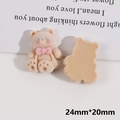 Détail d'accessoires DIY ours floqués beige avec nœuds roses et marquage de 24 mm - Ours Marron