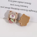 Front and back detail of brown flocked bear resin charms with small red strawberry - Brown Strawberry Bear