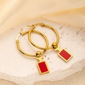 Golden hoop earrings featuring red perfume bottle silhouette pendants on a stone surface - Red Perfume Bottle Pendant Style (0421)