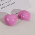Close-up of shiny lavender resin heart-shaped DIY craft parts for jewelry making - Rose Red Heart
