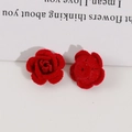 Detail of red flocked rose charms for DIY jewelry making with velvety texture - Red