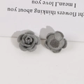 Macro shot of grey flocked rose DIY jewelry accessory showing fine velvet texture - Gray