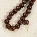 Close-up of 12mm hand-painted ceramic beads with vintage floral patterns in a tray - 3# Brown Green Leaf Bead / 12mm (1 Piece)