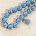 Macro shot of 12mm light blue ceramic beads with vintage floral patterns for DIY jewelry - 4# Blue Small Flower Bead / 12mm (1 Piece)