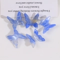 Close-up of five DIY butterfly charms with blue and white marble resin gradient texture - Small / Blue-Yellow