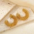 Golden spiral hoop earrings with delicate wire-wrapped design for a luxury style - Round Spring Hoop Earrings (0085) / Gold