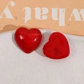 Close-up of heart-shaped resin charms with marble-textured translucent red finish - Red Heart