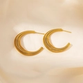 Golden titanium steel C-shaped hoop earrings with spiral texture on satin fabric - Spiral Spring Textured C-Shaped Hoop (0087) / Gold