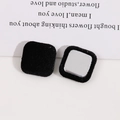 Macro shot of black flocked square metal buttons for DIY accessories and decorations - Black