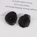 Detailed view of elegant black mesh flower earrings with central faceted crystal beads - Black