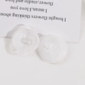 Detailed view of delicate white mesh petal flowers with center bead for DIY jewelry - White