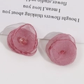 Detailed close-up of handmade 3D mesh flower accessory in dusty rose pink color - Pink