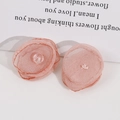 Close-up of handmade pink organza flowers with crystal beads for DIY hair accessories - Deep Pink
